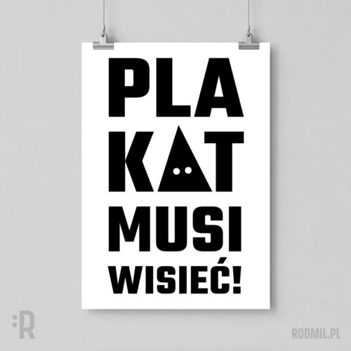Biały plakat na tle szarej ściany, wiszący na linkach z projektem graficznym PLAKAT MUSI WISIEĆ! Czarny napis, gdzie w członie KAT litera A wygląda jak czarny kaptur kata z białymi otworami na oczy.