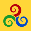 Projekt graficzny plakatu PRAWIA, JAWIA, NAWIA - TRISKELION. Symbol trzech spiralnych wirów w kolorach: czerwonym, niebieskim i zielonym, ułożonych w kole na żółtym tle.